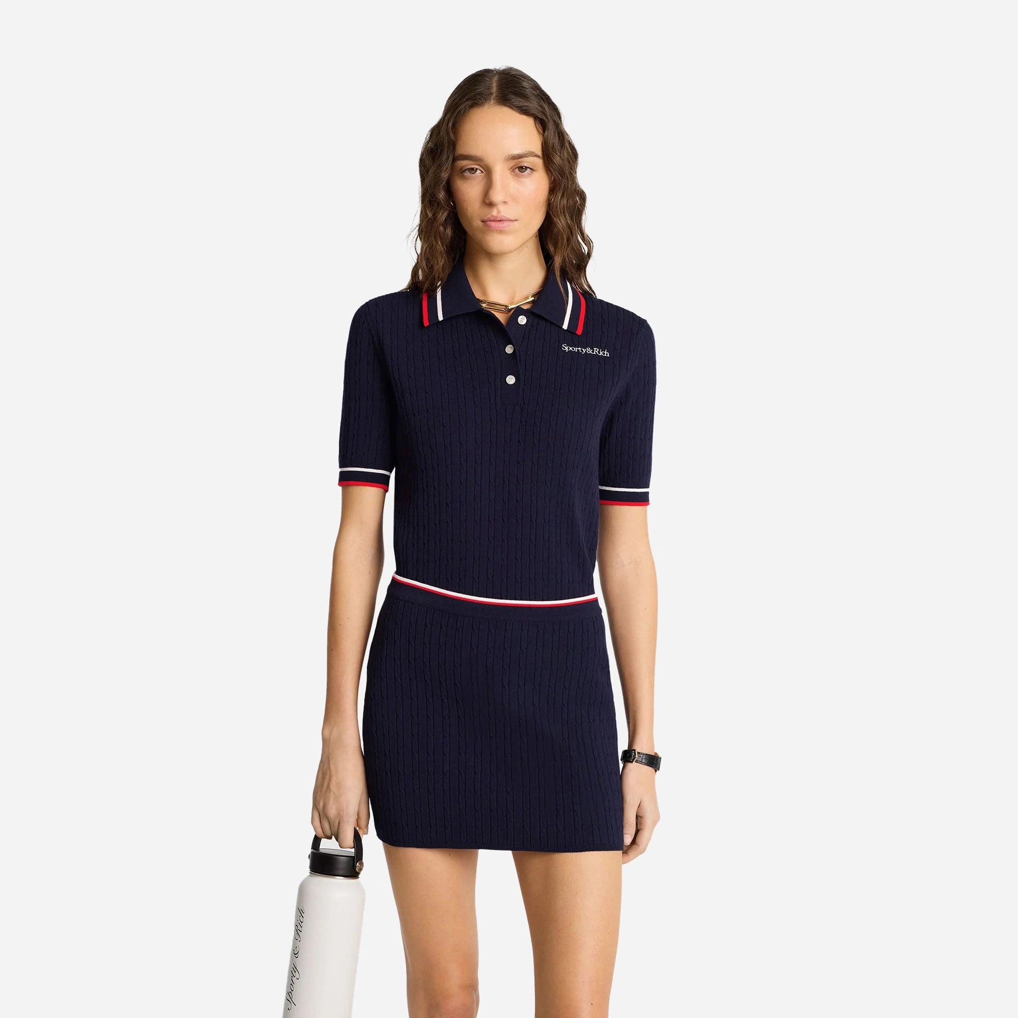 SPORTY & RICH | SERIF LOGO MINI CABLE SKIRT { NAVY