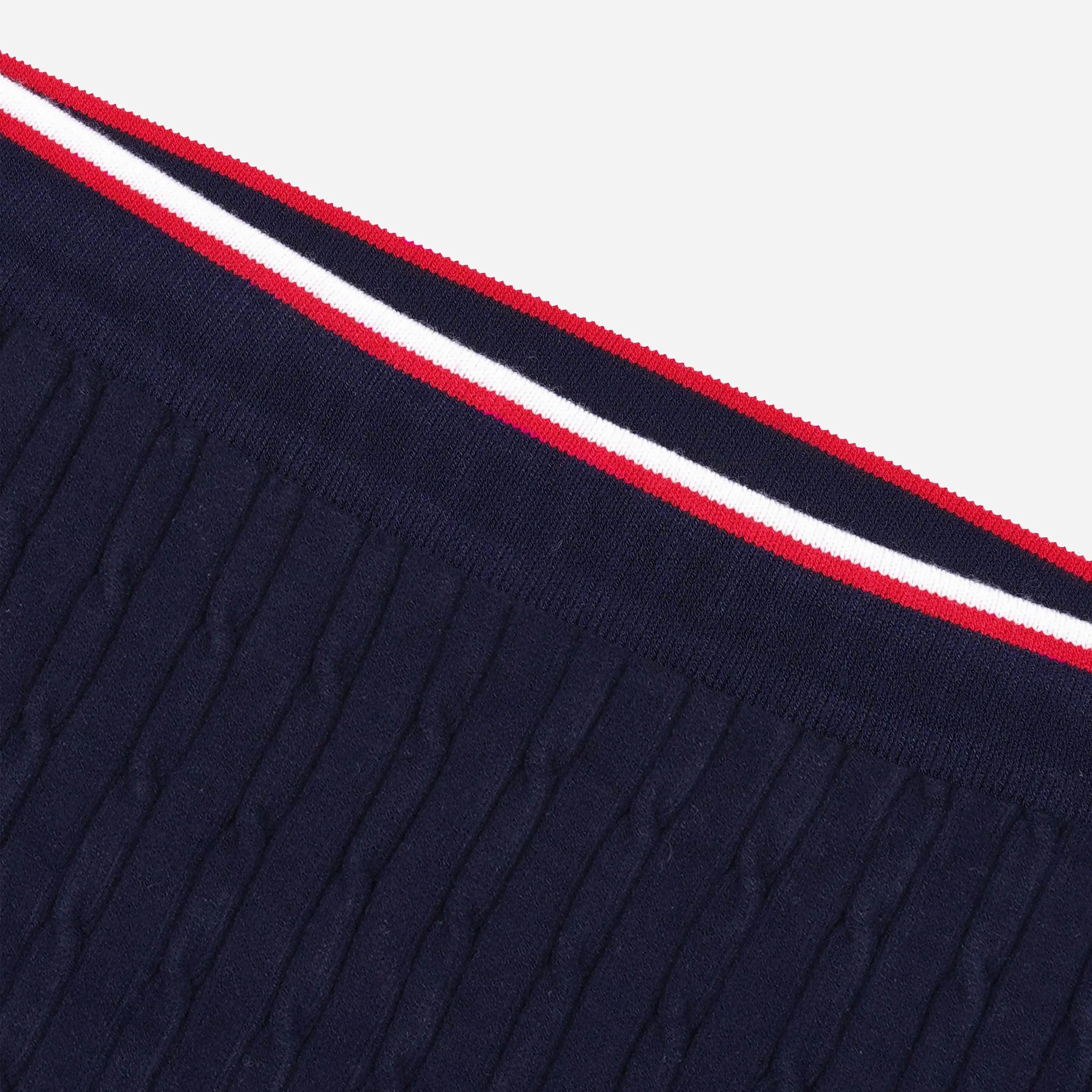 SPORTY & RICH | SERIF LOGO MINI CABLE SKIRT { NAVY